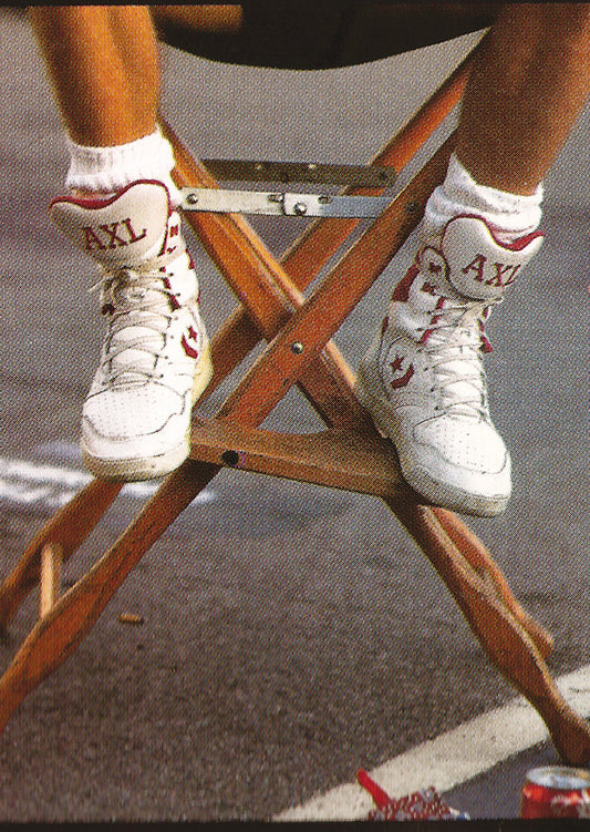 Axl Rose wearing custom-made sneakers from the back of the Guns N’ Roses album The Spaghetti Incident?